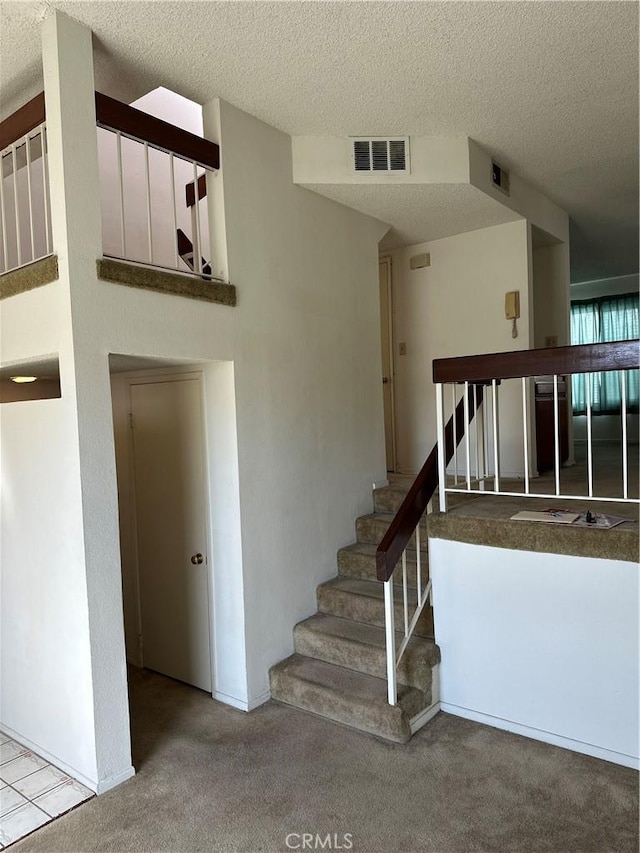 2231 Cedar St Unit G, Alhambra, CA 91801 - staircase with carpet and a textured ceiling