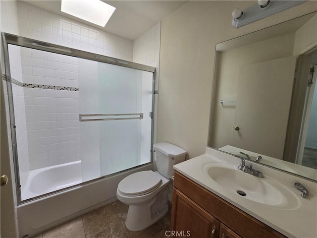 2231 Cedar St Unit G, Alhambra, CA 91801 - bathroom featuring toilet, vanity, shower / bath combination with glass door, and a skylight