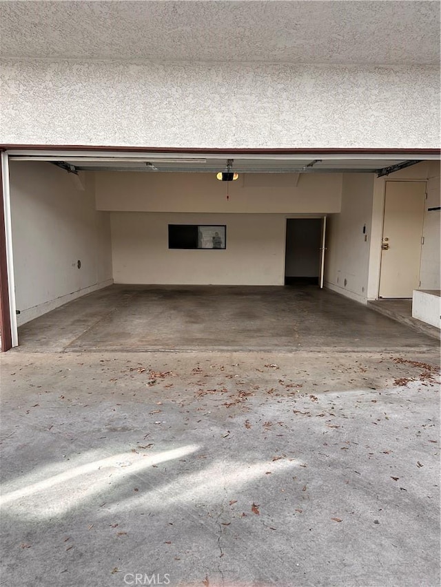 2231 Cedar St Unit G, Alhambra, CA 91801 - garage with a garage door opener and baseboards