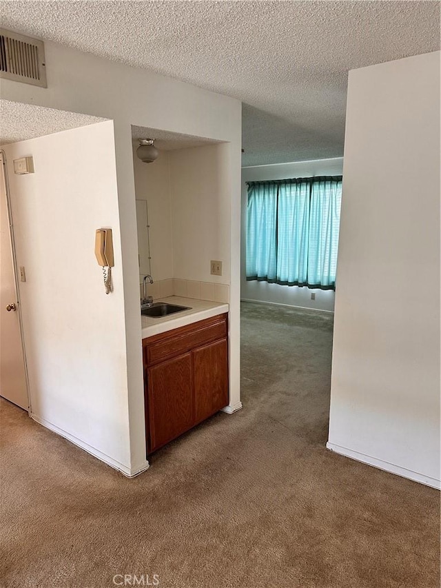 2231 Cedar St Unit G, Alhambra, CA 91801 - hallway with carpet flooring, a sink, and a textured ceiling