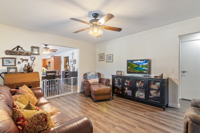 1471 Via Monserate, Fallbrook, CA 92028 - living room featuring a ceiling fan, wood finished floors, and baseboards