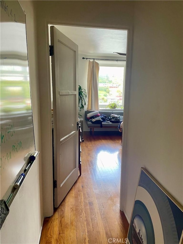 hall with light wood-style floors