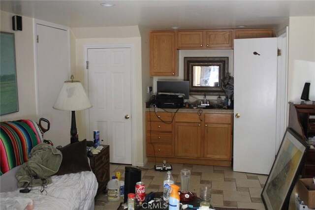 2859 Effie St, Los Angeles, CA 90026 - kitchen featuring brown cabinetry