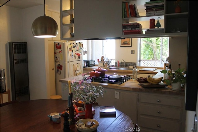 2859 Effie St, Los Angeles, CA 90026 - kitchen featuring a heating unit, freestanding refrigerator, black gas cooktop, and open shelves