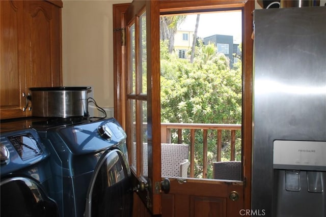 2859 Effie St, Los Angeles, CA 90026 - laundry area with cabinet space and washer and dryer
