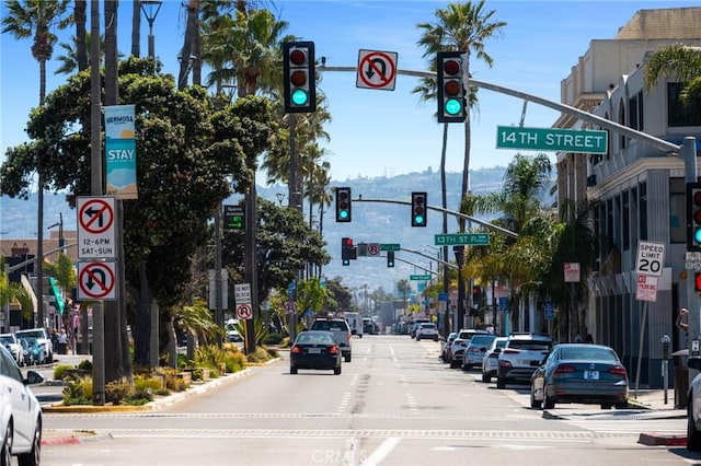 15 15th St Unit 6, Hermosa Beach, CA 90254 - view of asphalt road featuring traffic lights, traffic signs, street lighting, and curbs