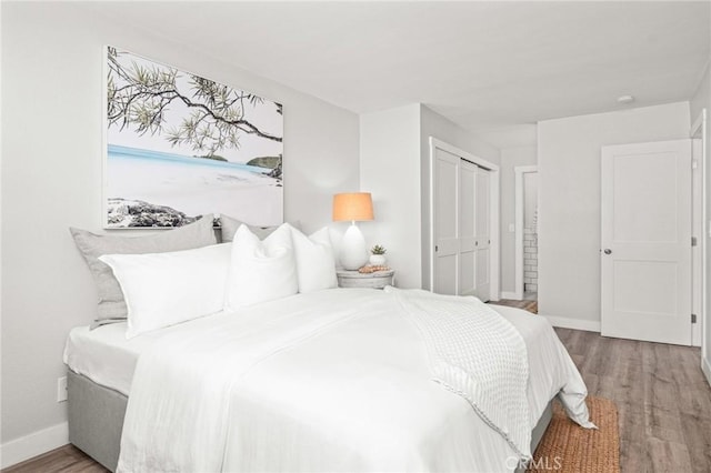 15 15th St Unit 6, Hermosa Beach, CA 90254 - bedroom featuring wood finished floors, baseboards, and a closet