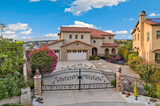 view of front of house featuring stucco siding, driveway, stone siding, a fenced front yard, and a tile roof