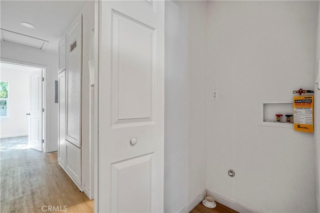 14320 Osborne St, Panorama City, CA 91402 - washroom with light wood finished floors, washer hookup, attic access, and baseboards