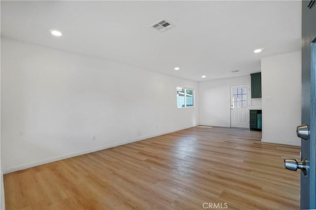 14320 Osborne St, Panorama City, CA 91402 - empty room with light wood-style floors, recessed lighting, and baseboards