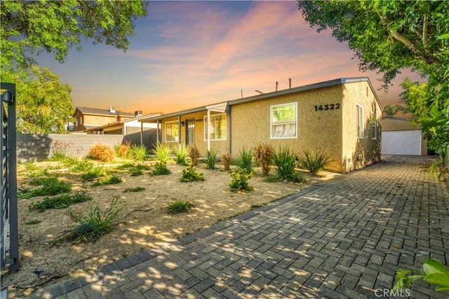 14320 Osborne St, Panorama City, CA 91402 - view of front of home featuring stucco siding and an outdoor structure