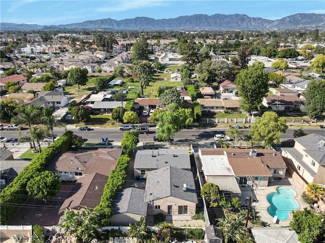 14320 Osborne St, Panorama City, CA 91402 - aerial view of property and surrounding area with nearby suburban area, a mountain backdrop, and a pool area