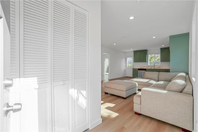 14320 Osborne St, Panorama City, CA 91402 - living area featuring light wood finished floors, recessed lighting, and baseboards