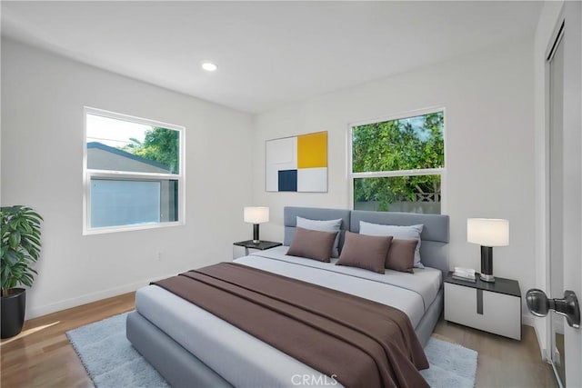 14320 Osborne St, Panorama City, CA 91402 - bedroom featuring light wood-style flooring, baseboards, and recessed lighting