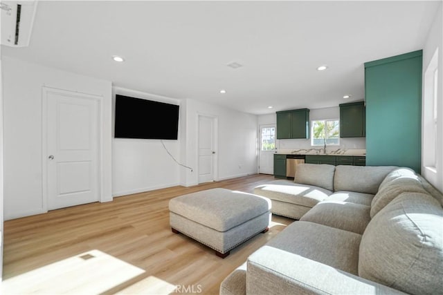 14320 Osborne St, Panorama City, CA 91402 - living room featuring light wood-style flooring, recessed lighting, and baseboards