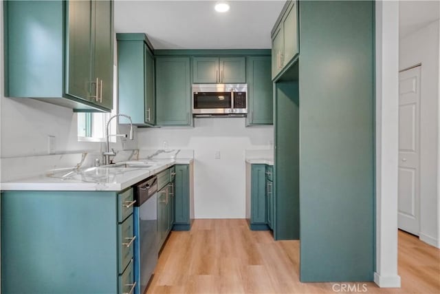 14320 Osborne St, Panorama City, CA 91402 - kitchen with appliances with stainless steel finishes, a sink, light wood-style flooring, green cabinets, and recessed lighting