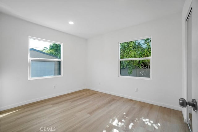 14320 Osborne St, Panorama City, CA 91402 - spare room featuring healthy amount of natural light, light wood-type flooring, baseboards, and recessed lighting