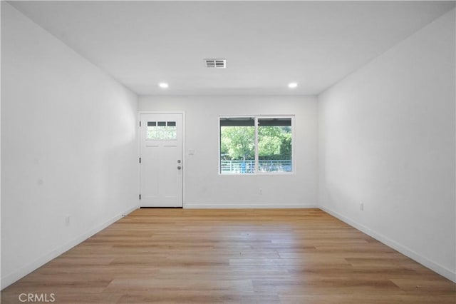 14320 Osborne St, Panorama City, CA 91402 - entryway with light wood-style flooring, recessed lighting, and baseboards
