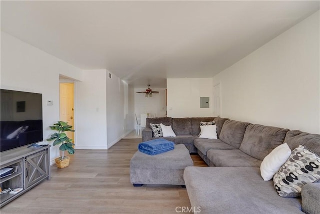 1386 E Madison Ave Unit 21, El Cajon, CA 92021 - living area with light wood-type flooring, baseboards, a ceiling fan, and electric panel