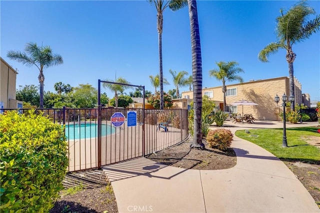 1386 E Madison Ave Unit 21, El Cajon, CA 92021 - view of home's community featuring a pool and fence