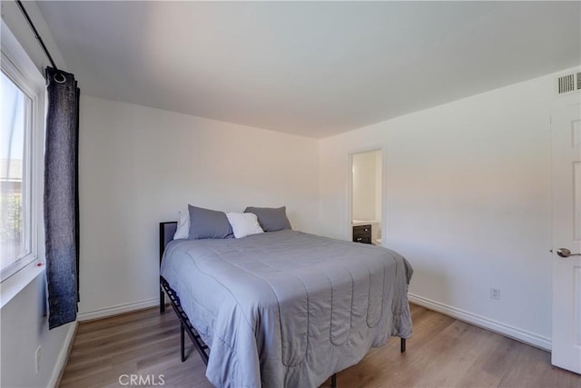 1386 E Madison Ave Unit 21, El Cajon, CA 92021 - bedroom featuring wood finished floors and baseboards