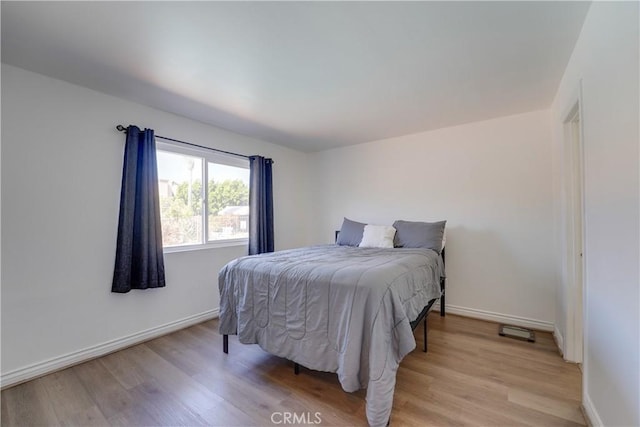 1386 E Madison Ave Unit 21, El Cajon, CA 92021 - bedroom with light wood-style flooring and baseboards