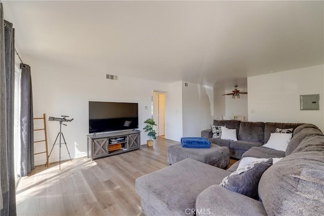 1386 E Madison Ave Unit 21, El Cajon, CA 92021 - living area with electric panel, light wood finished floors, ceiling fan, and visible vents