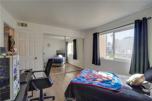 1386 E Madison Ave Unit 21, El Cajon, CA 92021 - bedroom with a closet, visible vents, multiple windows, and wood finished floors