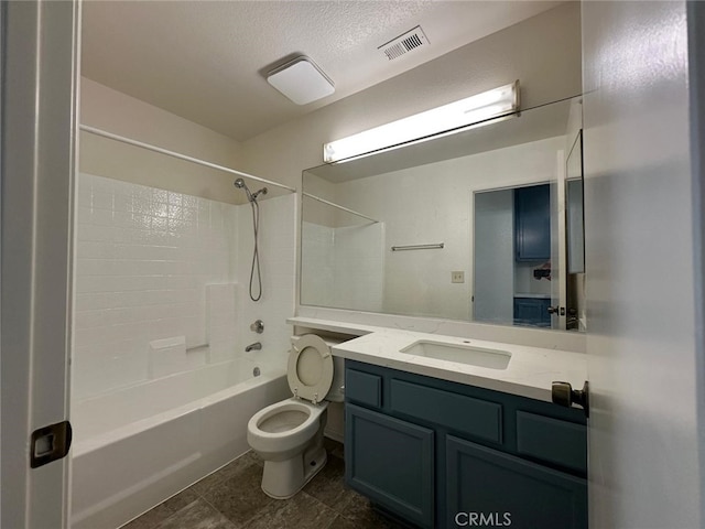 bathroom with visible vents, toilet, vanity, shower / tub combination, and a textured ceiling