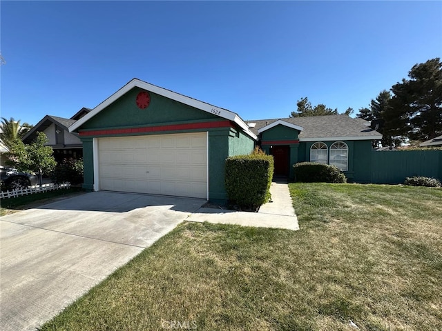 ranch-style house with driveway, a front yard, and a garage