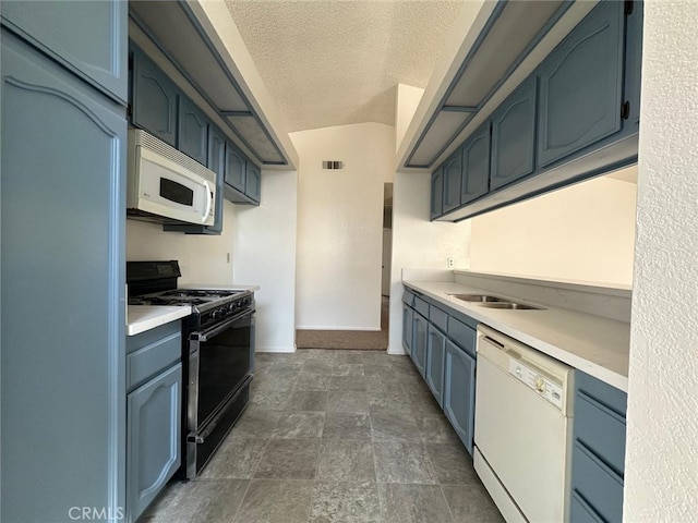 kitchen with visible vents, a sink, white appliances, and light countertops