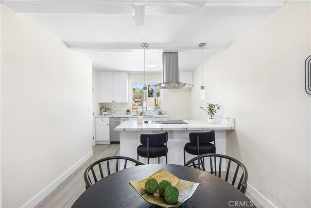 1000 W Macarthur Blvd Unit 106, Santa Ana, CA 92707 - dining area featuring baseboards and light wood-style flooring