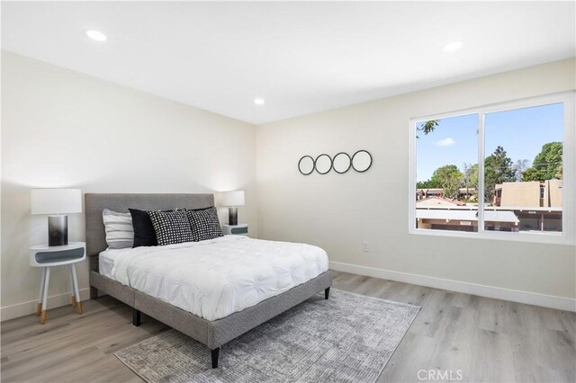 1000 W Macarthur Blvd Unit 106, Santa Ana, CA 92707 - bedroom featuring baseboards, light wood-type flooring, and recessed lighting