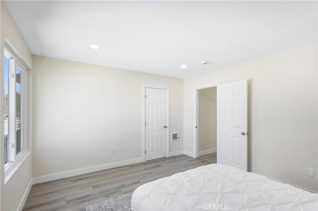 1000 W Macarthur Blvd Unit 106, Santa Ana, CA 92707 - bedroom featuring wood finished floors, recessed lighting, and baseboards