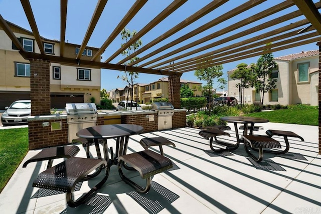 view of patio / terrace featuring area for grilling, a pergola, and a residential view