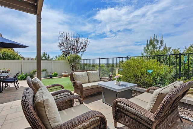 view of patio featuring a fenced backyard and an outdoor living space