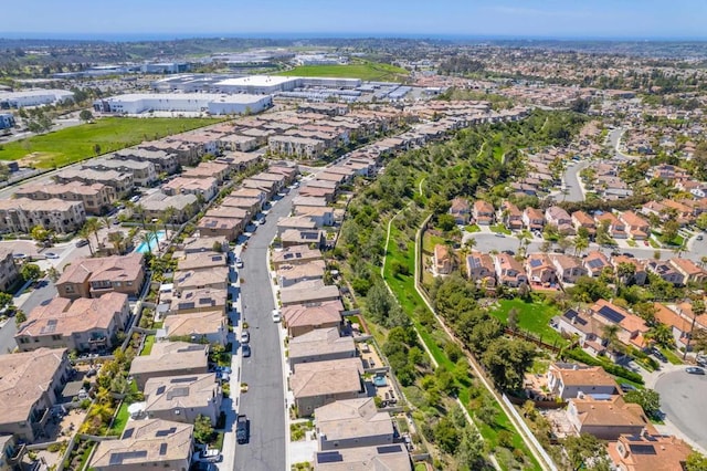 birds eye view of property with a residential view