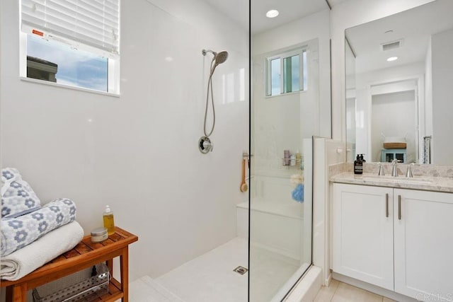 bathroom with walk in shower and a wealth of natural light