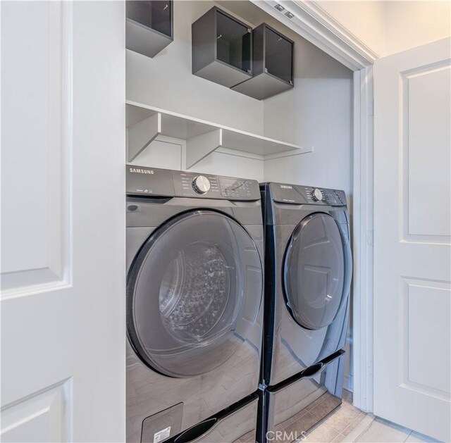 1245 Oliva Ct, Duarte, CA 91010 - laundry area featuring washing machine and clothes dryer and light tile patterned flooring