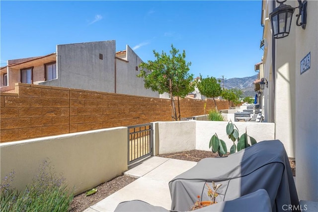 1245 Oliva Ct, Duarte, CA 91010 - view of patio with a mountain view and a gate