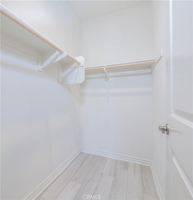 1245 Oliva Ct, Duarte, CA 91010 - walk in closet featuring light wood-style floors