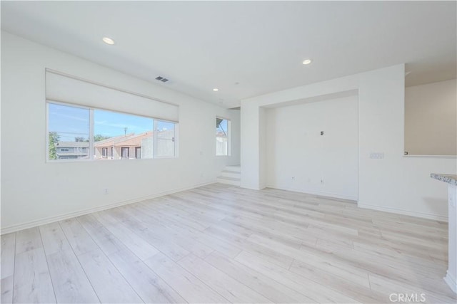 1245 Oliva Ct, Duarte, CA 91010 - spare room featuring light wood-style floors, stairs, and recessed lighting