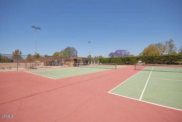 view of sport court with fence and community basketball court
