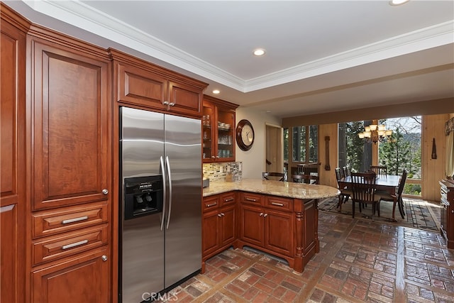 28018 Peninsula, Lake Arrowhead, CA 92352 - kitchen with built in fridge, brick floors, a peninsula, a chandelier, and glass insert cabinets