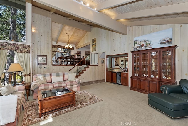 28018 Peninsula, Lake Arrowhead, CA 92352 - living area with a chandelier, stairway, wood walls, beverage cooler, and light colored carpet