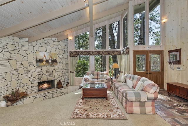 28018 Peninsula, Lake Arrowhead, CA 92352 - living area with a stone fireplace, a high ceiling, and a wooden ceiling with exposed beams