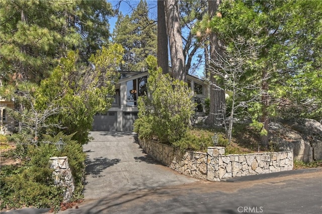 28018 Peninsula, Lake Arrowhead, CA 92352 - obstructed view of property featuring driveway and an attached garage