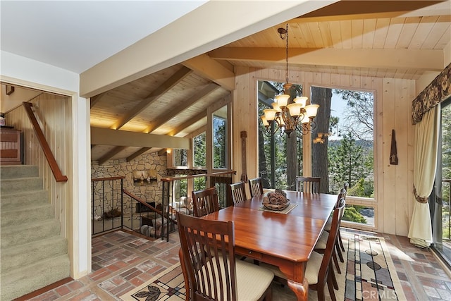 28018 Peninsula, Lake Arrowhead, CA 92352 - dining space featuring a chandelier, wooden ceiling, brick floors, wooden walls, and plenty of natural light