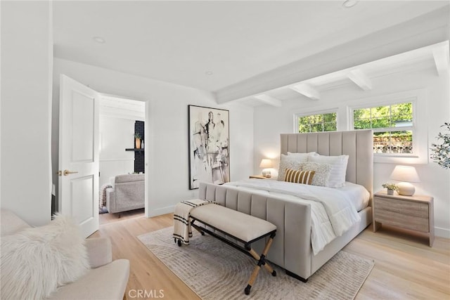 13807 Wyandotte St, Van Nuys, CA 91405 - bedroom with light wood-style flooring, baseboards, and beam ceiling