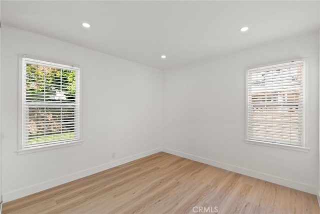 13807 Wyandotte St, Van Nuys, CA 91405 - unfurnished room with light wood-style floors, baseboards, and recessed lighting
